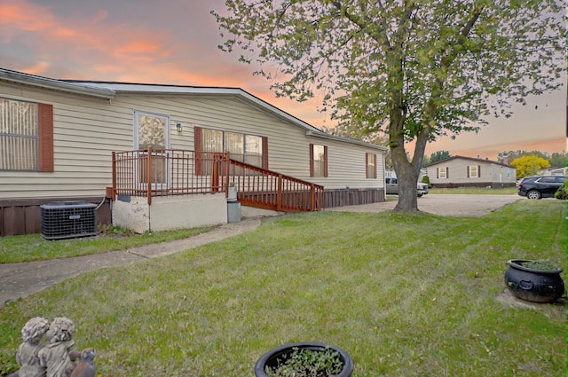 14424 Grenwich Ct, Shelby Twp, MI 48315 - manufactured / mobile home featuring a lawn and central AC unit