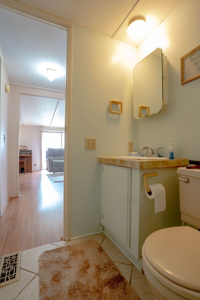 14424 Grenwich Ct, Shelby Twp, MI 48315 - bathroom with toilet, wood finished floors, and vanity
