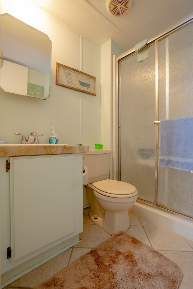 14424 Grenwich Ct, Shelby Twp, MI 48315 - full bathroom with toilet, a stall shower, tile patterned floors, and vanity
