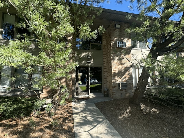 view of side of home featuring brick siding