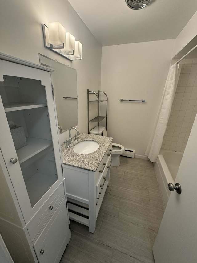bathroom with a baseboard heating unit, vanity, toilet, and shower / bath combo with shower curtain