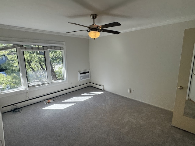 empty room with carpet flooring, crown molding, a wall unit AC, a baseboard heating unit, and a ceiling fan