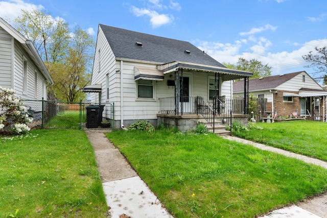 17041 Henry St, Melvindale, MI 48122 - view of front facade featuring a gate, covered porch, and a shingled roof