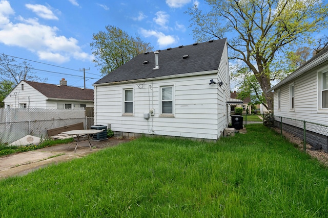 17041 Henry St, Melvindale, MI 48122 - rear view of property featuring roof with shingles, central AC unit, and a patio area