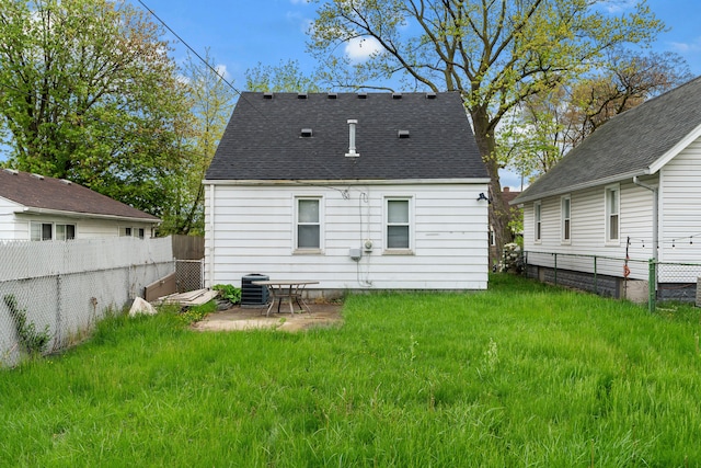 17041 Henry St, Melvindale, MI 48122 - back of property with a fenced backyard, a shingled roof, and central air condition unit