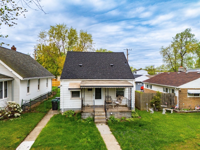 17041 Henry St, Melvindale, MI 48122 - view of front of property with covered porch, a gate, and a shingled roof