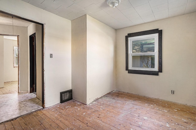 empty room featuring wood-type flooring