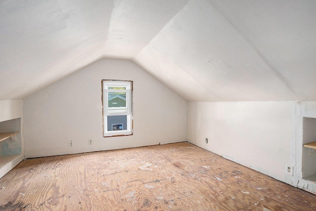additional living space with vaulted ceiling