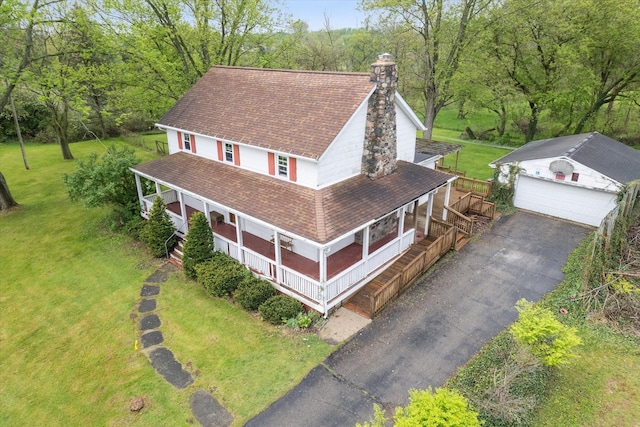 view from above of property with a heavily wooded area