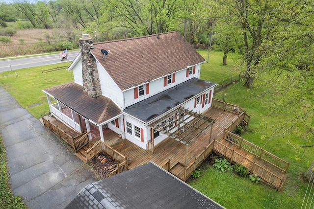 aerial view of property and surrounding area featuring a forest
