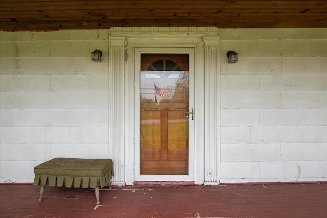 entrance to property with concrete block siding