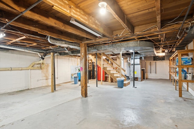 unfinished below grade area featuring stairs