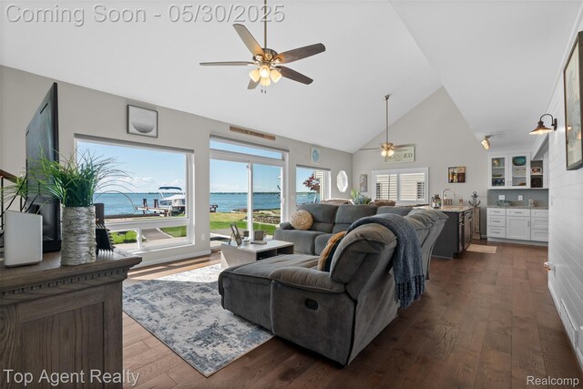 7910 Anchor Bay Dr, Clay, MI 48001 - living room featuring a ceiling fan, high vaulted ceiling, healthy amount of natural light, dark wood-style floors, and a water view