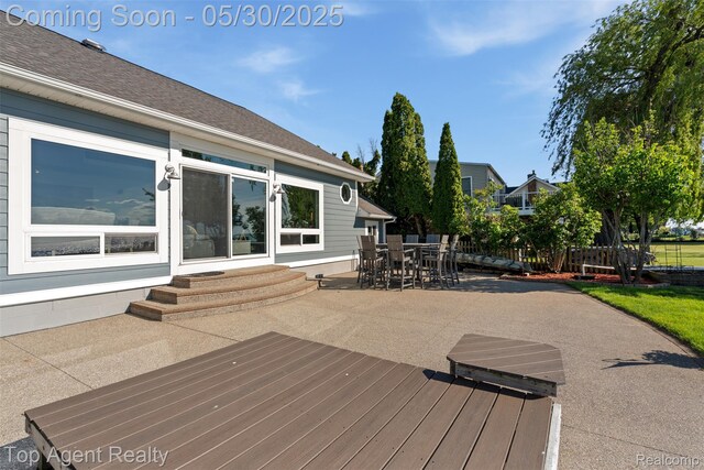 7910 Anchor Bay Dr, Clay, MI 48001 - wooden deck with a patio, outdoor dining area, and entry steps
