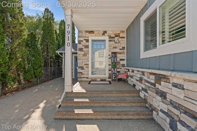 7910 Anchor Bay Dr, Clay, MI 48001 - view of exterior entry with board and batten siding and stone siding