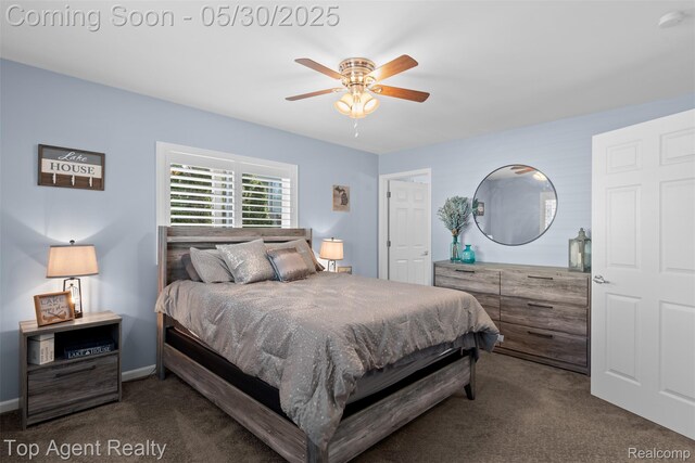 7910 Anchor Bay Dr, Clay, MI 48001 - bedroom with dark carpet and ceiling fan