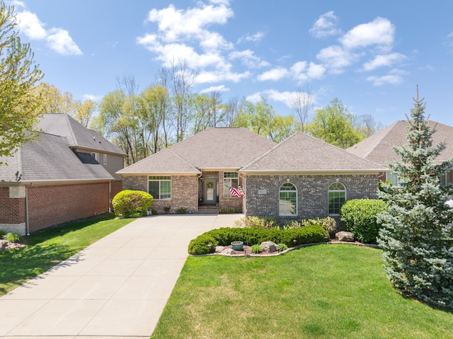 58651 Glacier Club Dr, Washington, MI 48094 - view of front of property with brick siding, driveway, a front lawn, and a shingled roof