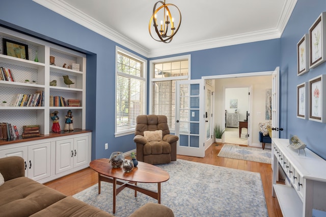 58651 Glacier Club Dr, Washington, MI 48094 - living area featuring a chandelier, healthy amount of natural light, light wood-style flooring, crown molding, and baseboards