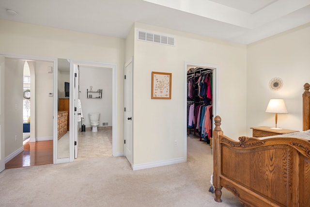 58651 Glacier Club Dr, Washington, MI 48094 - bedroom with light carpet, a spacious closet, a closet, and baseboards