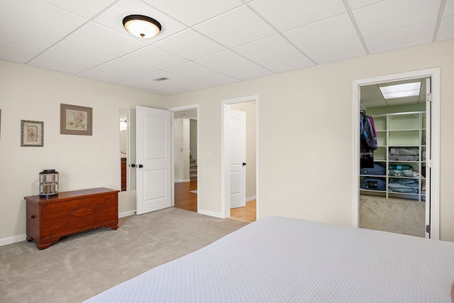 58651 Glacier Club Dr, Washington, MI 48094 - bedroom featuring carpet flooring, a drop ceiling, a spacious closet, a closet, and baseboards