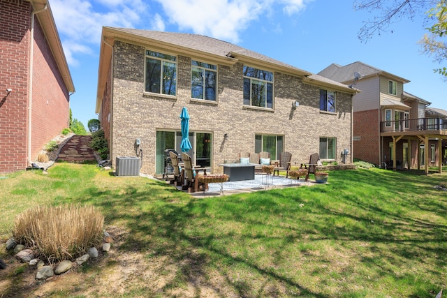 58651 Glacier Club Dr, Washington, MI 48094 - back of house featuring outdoor lounge area, a yard, a patio, brick siding, and central AC