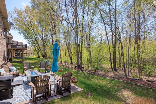 58651 Glacier Club Dr, Washington, MI 48094 - view of grassy yard featuring a fire pit and a patio area