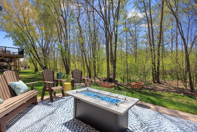 58651 Glacier Club Dr, Washington, MI 48094 - view of patio / terrace featuring an outdoor fire pit, a forest view, and a deck