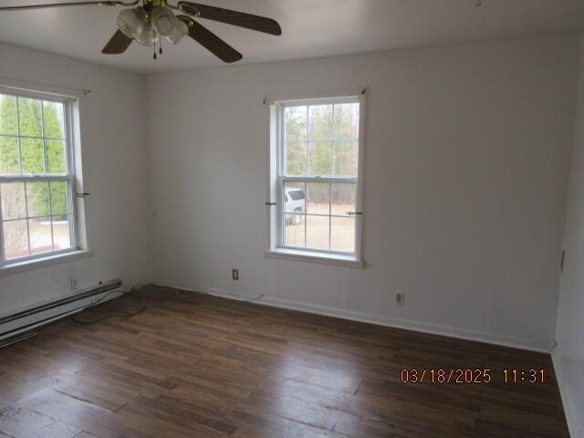 34637 76th St, Covert, MI 49043 - spare room with wood finished floors, ceiling fan, and baseboards