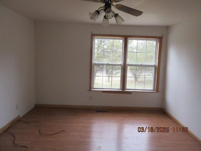 34637 76th St, Covert, MI 49043 - unfurnished room with a ceiling fan, light wood-type flooring, and baseboards