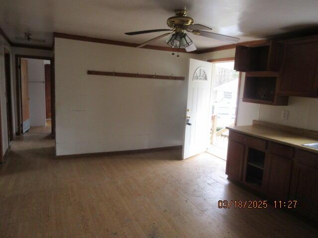 34637 76th St, Covert, MI 49043 - kitchen with open shelves, a ceiling fan, light wood-style floors, and baseboards