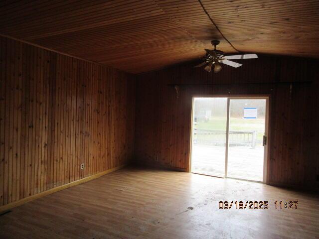 34637 76th St, Covert, MI 49043 - spare room featuring a ceiling fan, vaulted ceiling, wooden walls, wood finished floors, and wood ceiling