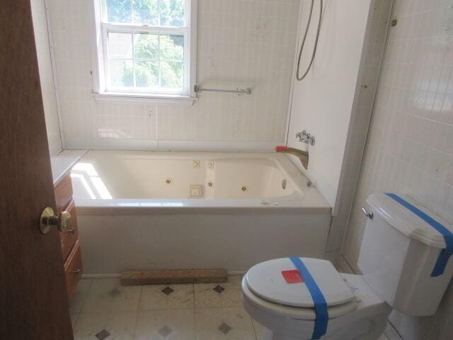 34637 76th St, Covert, MI 49043 - full bathroom featuring toilet and tile patterned flooring