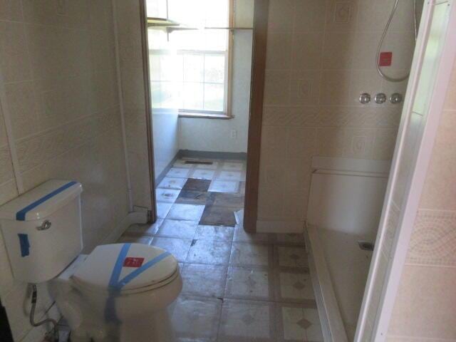 34637 76th St, Covert, MI 49043 - full bath with a shower, tile patterned floors, and tile walls