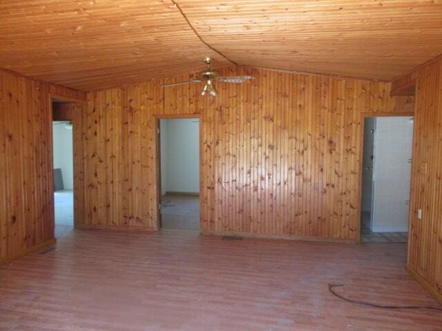 34637 76th St, Covert, MI 49043 - spare room featuring lofted ceiling, wood ceiling, wood finished floors, and wood walls