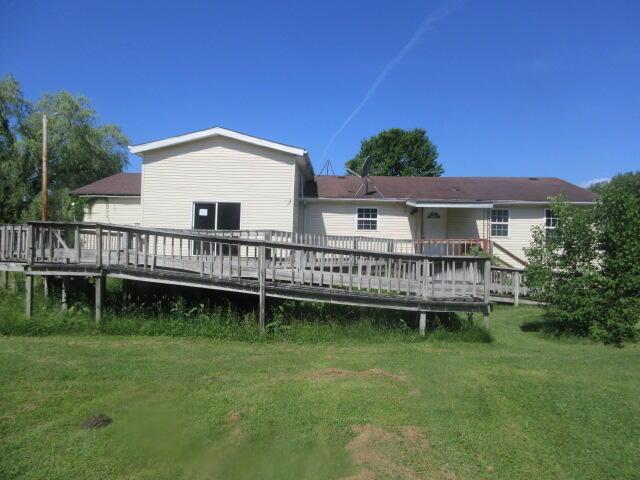 34637 76th St, Covert, MI 49043 - rear view of property with a deck and a lawn