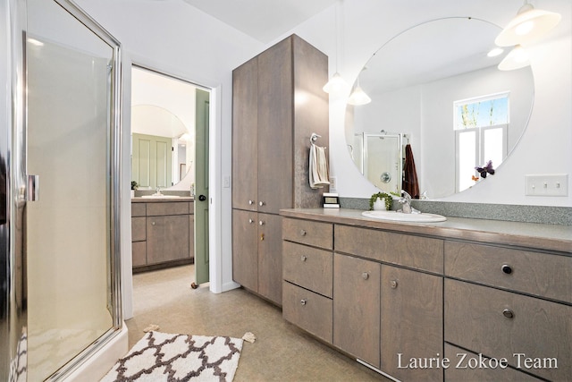 12250 Knoper Ct, Allendale, MI 49401 - bathroom featuring a stall shower and vanity