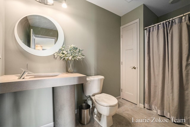 12250 Knoper Ct, Allendale, MI 49401 - bathroom featuring toilet and tile patterned flooring