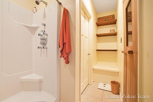 12250 Knoper Ct, Allendale, MI 49401 - bathroom with tile patterned floors and a shower