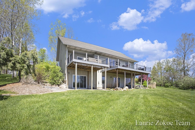 12250 Knoper Ct, Allendale, MI 49401 - back of property with a yard, a deck, and roof with shingles
