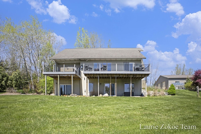 12250 Knoper Ct, Allendale, MI 49401 - rear view of property with a deck, roof with shingles, and a lawn