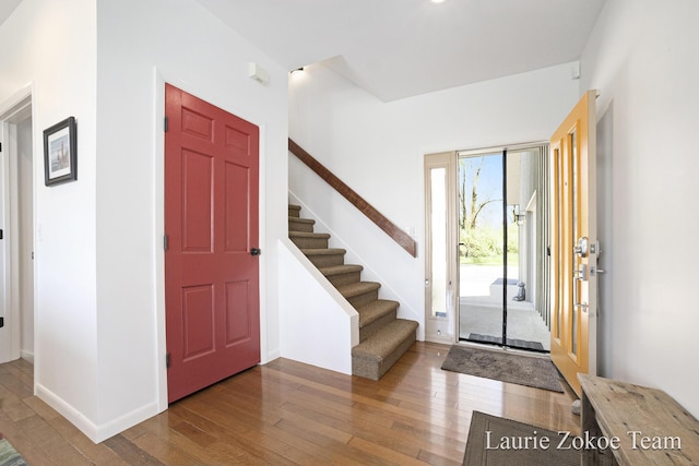12250 Knoper Ct, Allendale, MI 49401 - foyer featuring hardwood / wood-style floors, stairs, and baseboards