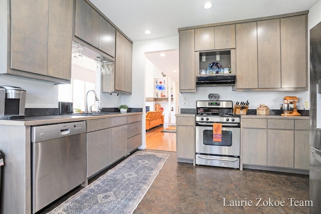 12250 Knoper Ct, Allendale, MI 49401 - kitchen with stainless steel appliances, range hood, a sink, recessed lighting, and dark countertops