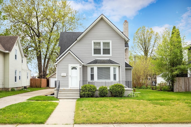 view of front of home featuring a chimney and a shingled roof