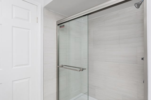 bathroom with a shower stall