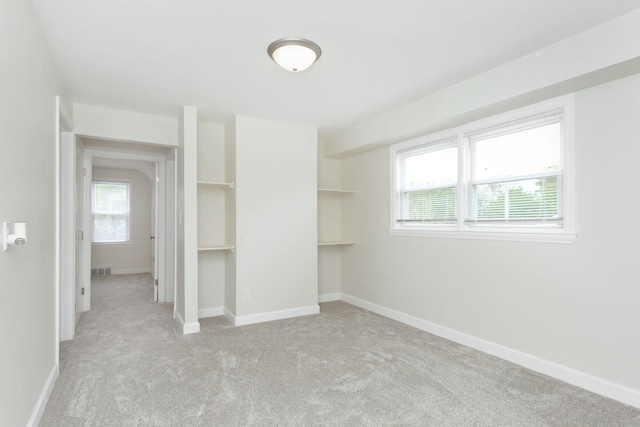 unfurnished bedroom featuring carpet flooring and baseboards