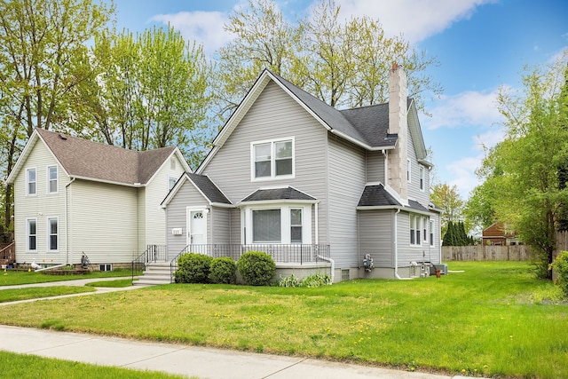 traditional home with a chimney and roof with shingles