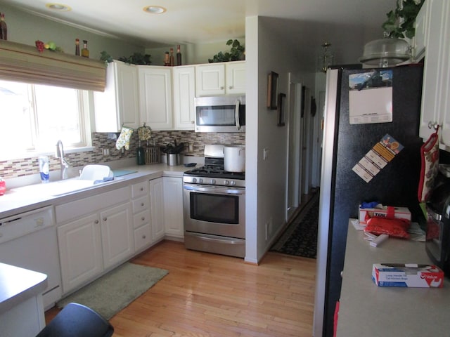 29100 Sunnydale St, Livonia, MI 48154 - kitchen with appliances with stainless steel finishes, decorative backsplash, white cabinetry, and recessed lighting