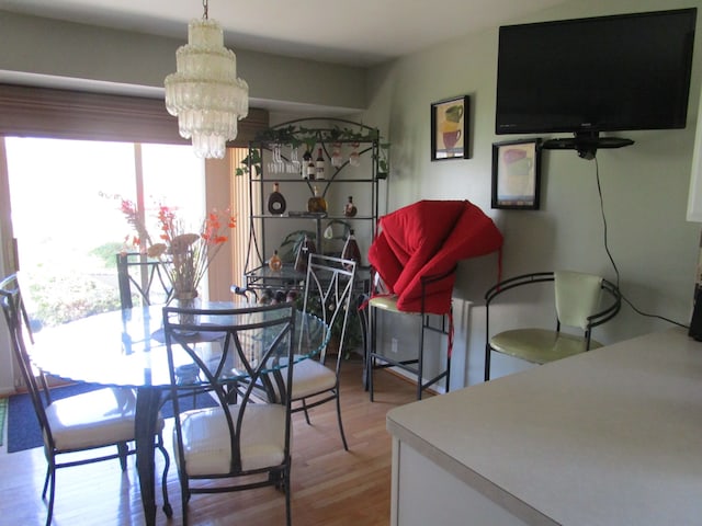 29100 Sunnydale St, Livonia, MI 48154 - dining room featuring a chandelier and wood finished floors