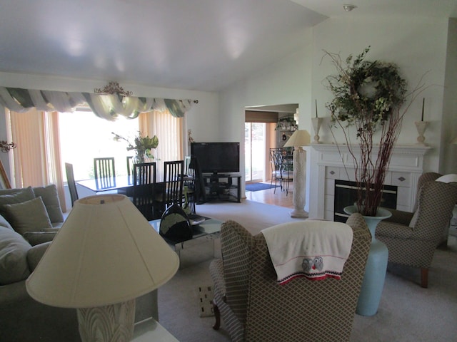 29100 Sunnydale St, Livonia, MI 48154 - living room featuring lofted ceiling, a tiled fireplace, and carpet flooring