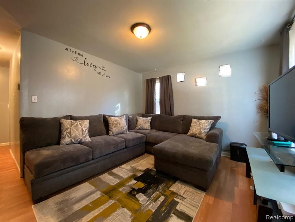 11107 Hudson Ave, Warren, MI 48089 - living room with light wood-style floors
